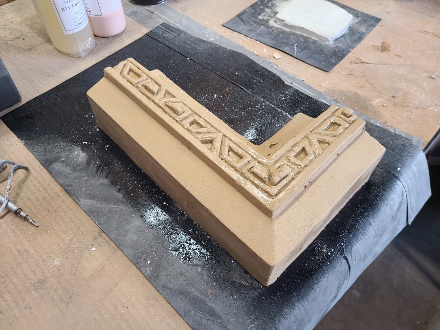 Recast terracotta window frame with intricate geometric designs ready for install